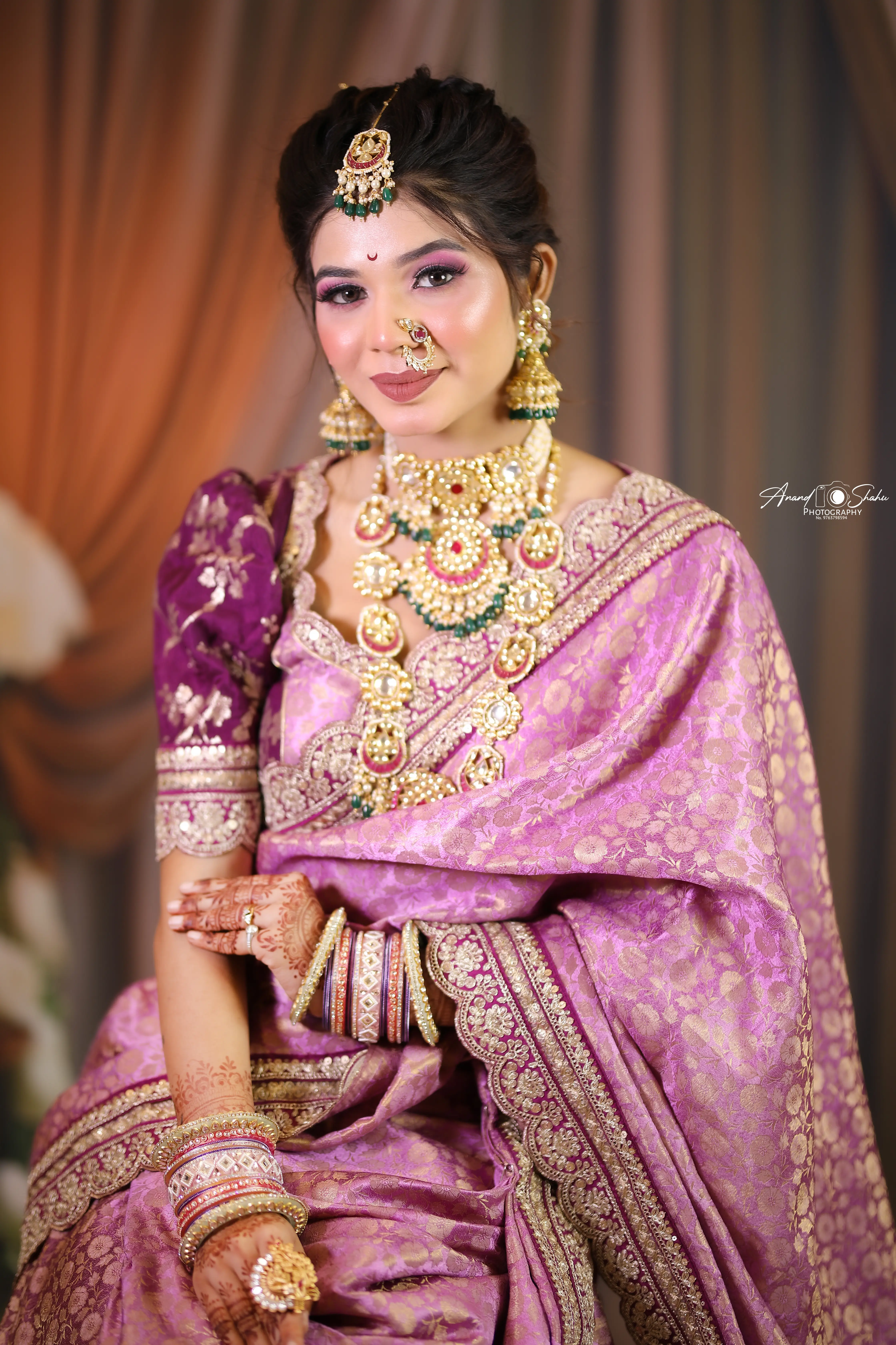 HD bridal makeup with soft curls at 7 Mirrors Unisex Luxe Salon Nagpur