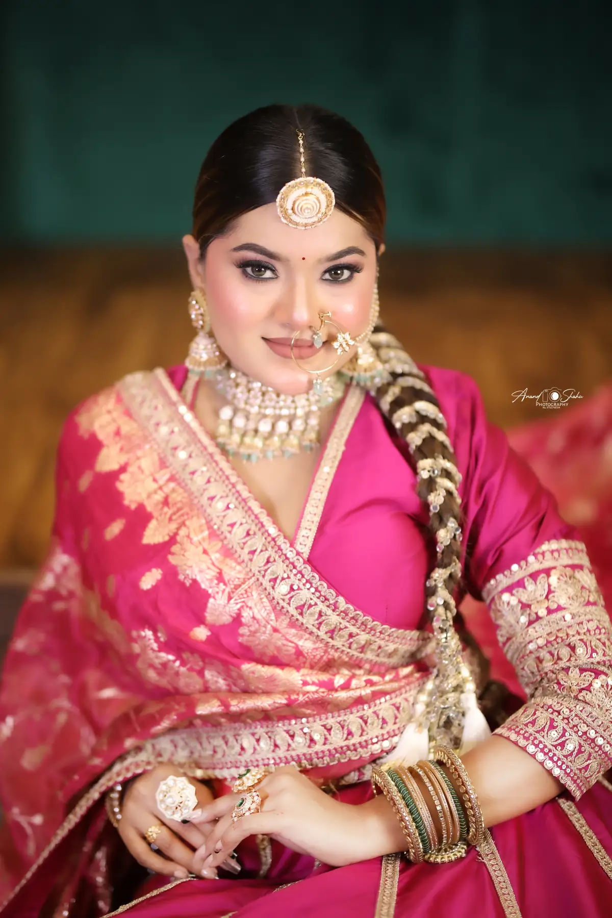 Bridal hairstyling by Shweta Kadu – sleek centre-parted hair with an embellished braid and maang tikka