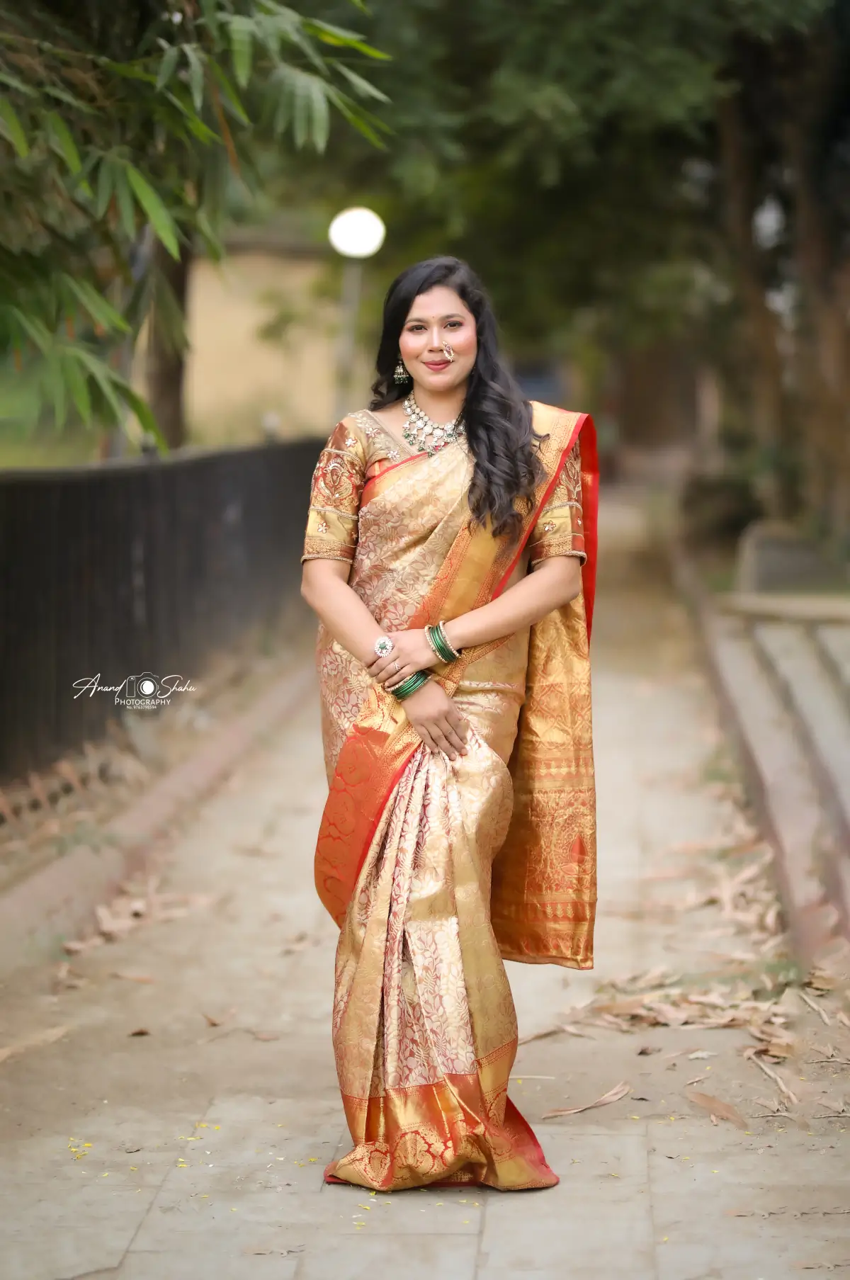 Engagement makeup look by Shweta Kadu – soft natural makeup with open waves and a gold Paithani saree